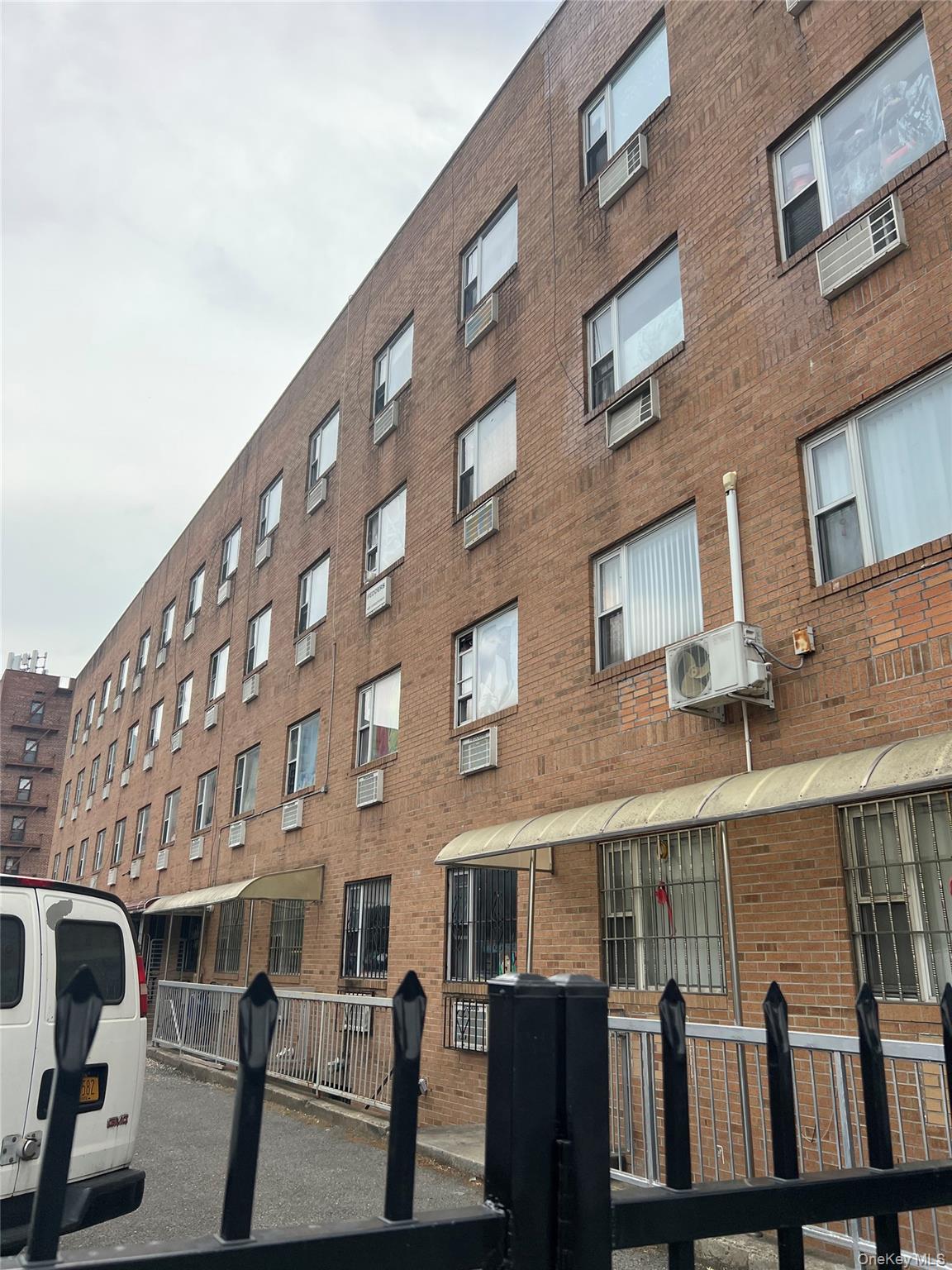 55-05 98th Street Queens, NY 11368 - Photo 2 of 12 View of property featuring a cooling unit and an AC wall unit