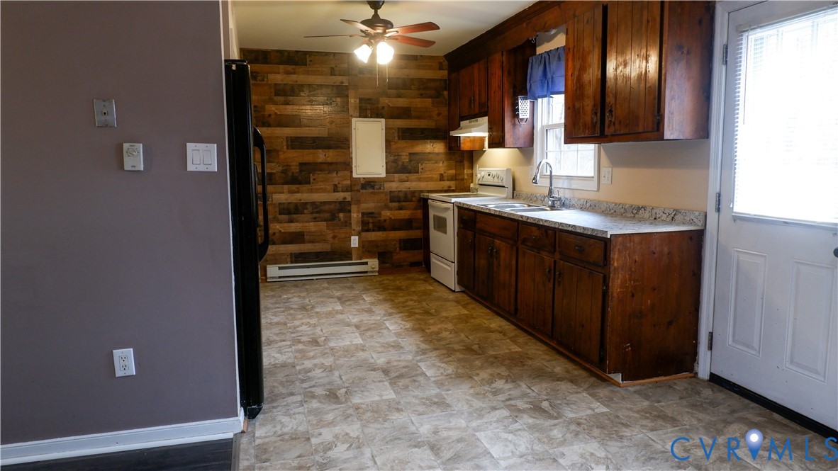 4524 Twelveoaks Road Midlothian, VA 23112 - Photo 2 of 12 a bathroom with a sink and a large mirror