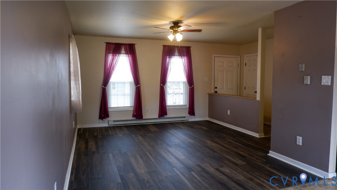 4524 Twelveoaks Road Midlothian, VA 23112 - Photo 4 of 12 an empty room with wooden floor and windows
