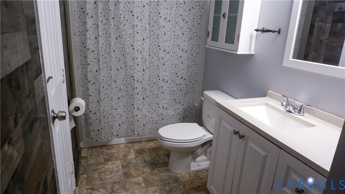 4524 Twelveoaks Road Midlothian, VA 23112 - Photo 7 of 12 a bathroom with a sink toilet and a mirror