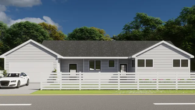 a view of house that has a big yard with large trees