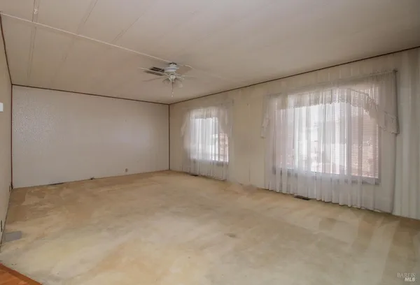 an empty room with windows