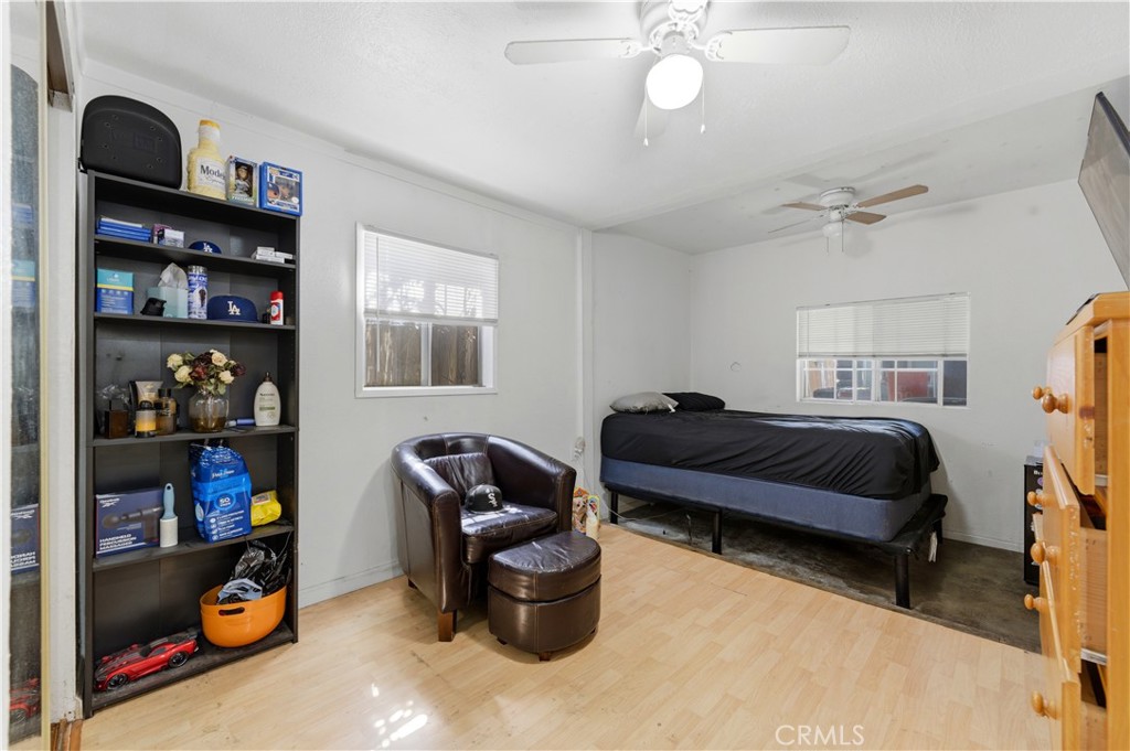 121 East 68th Way Long Beach, CA 90805 - Photo 16 of 17 a bedroom with a bed workspace and a window