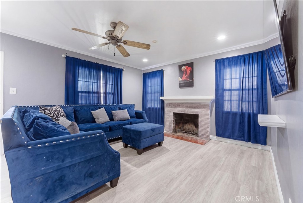 121 East 68th Way Long Beach, CA 90805 - Photo 3 of 17 a living room with furniture and a fireplace