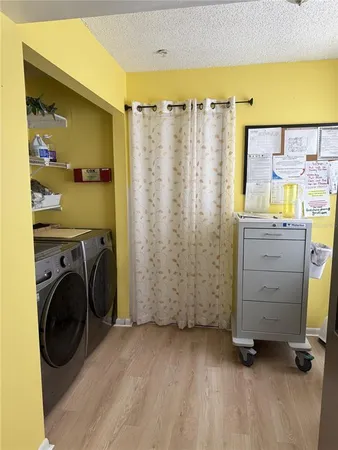 a view of a storage & utility room with closet window