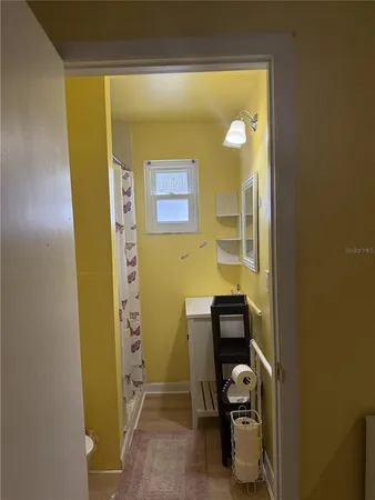 a view of a hallway with storage area