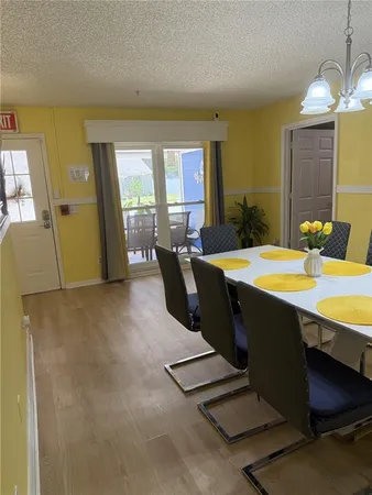 a view of a dining room with furniture and window