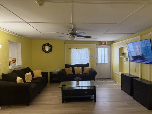 a living room with couch and a window
