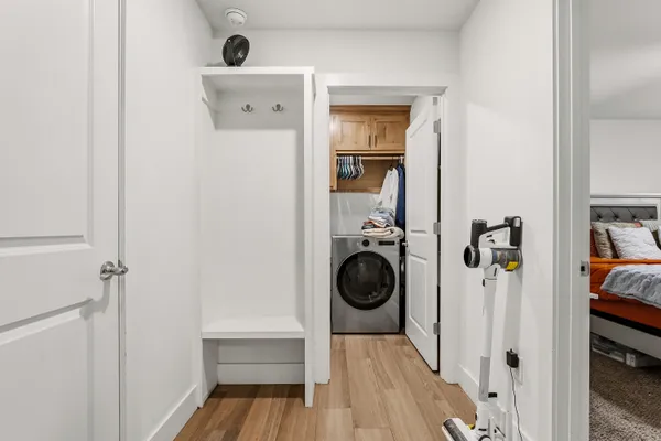 a view of a hallway with a washer and dryer