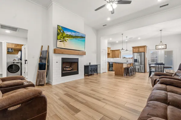 a living room with furniture and a fireplace