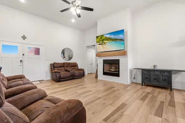 a living room with furniture and a fireplace