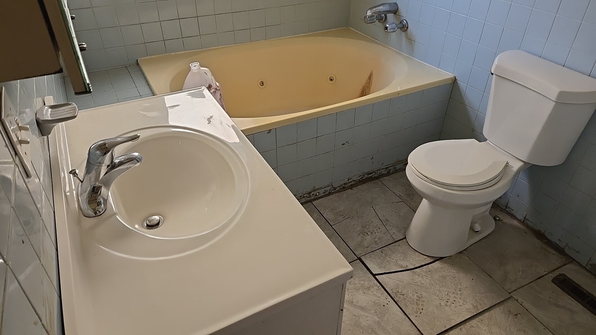 612 East 90th Street Chicago, IL 60619 - Photo 15 of 22 a bathroom with a toilet and a sink