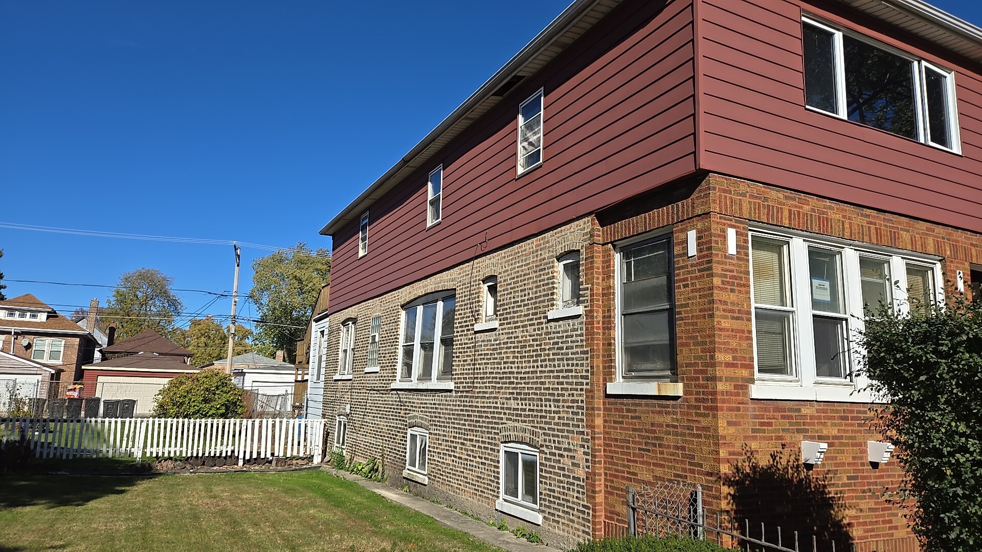 612 East 90th Street Chicago, IL 60619 - Photo 2 of 22 a front view of a house with a yard