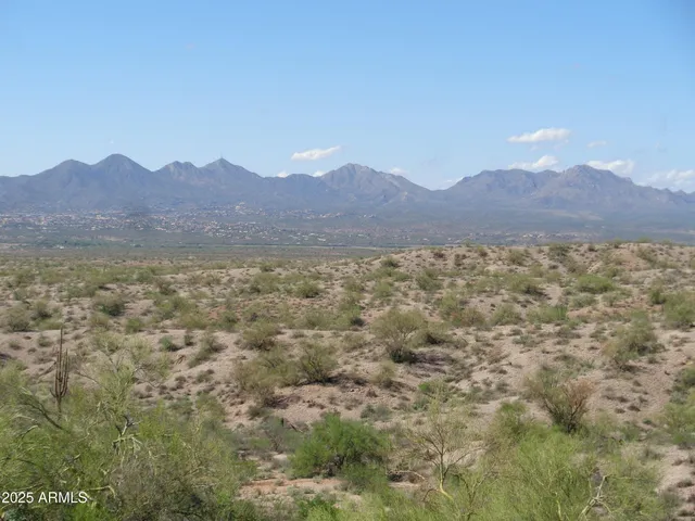 a view of an outdoor space and mountain view in middle of house