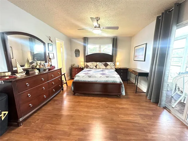 a bed room with a bed and a mirror