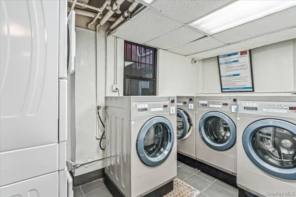 a view of a storage & utility room with washer and dryer