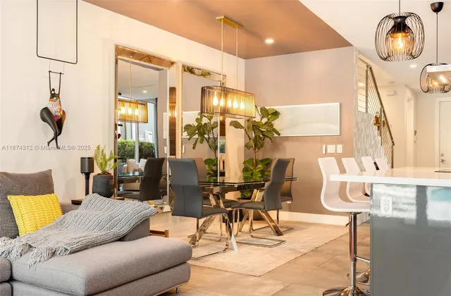 a living room with furniture and a mirror