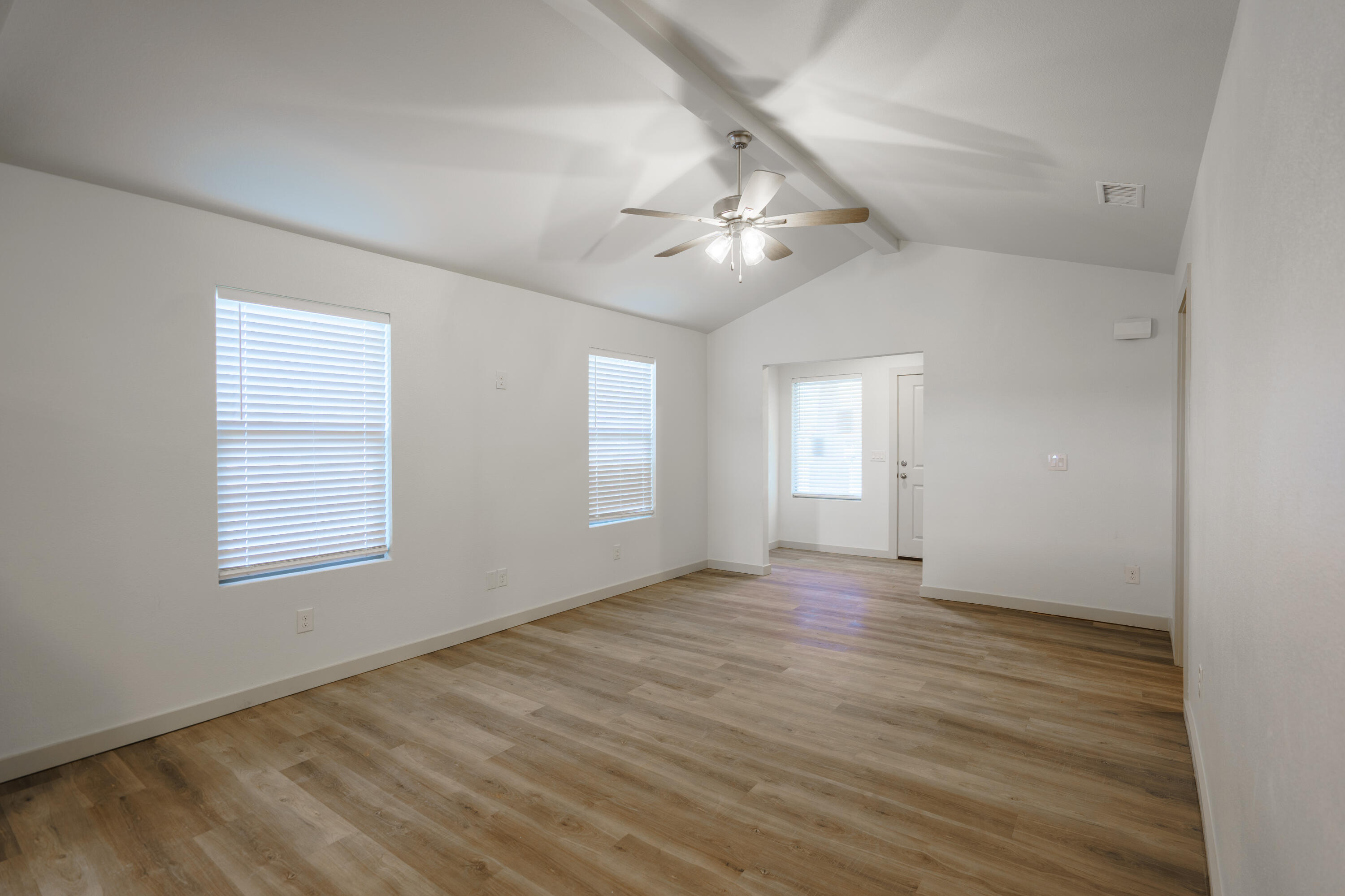 2208 N Avenue North Lubbock, TX 79403 - Photo 4 of 13 an empty room with wooden floor and windows