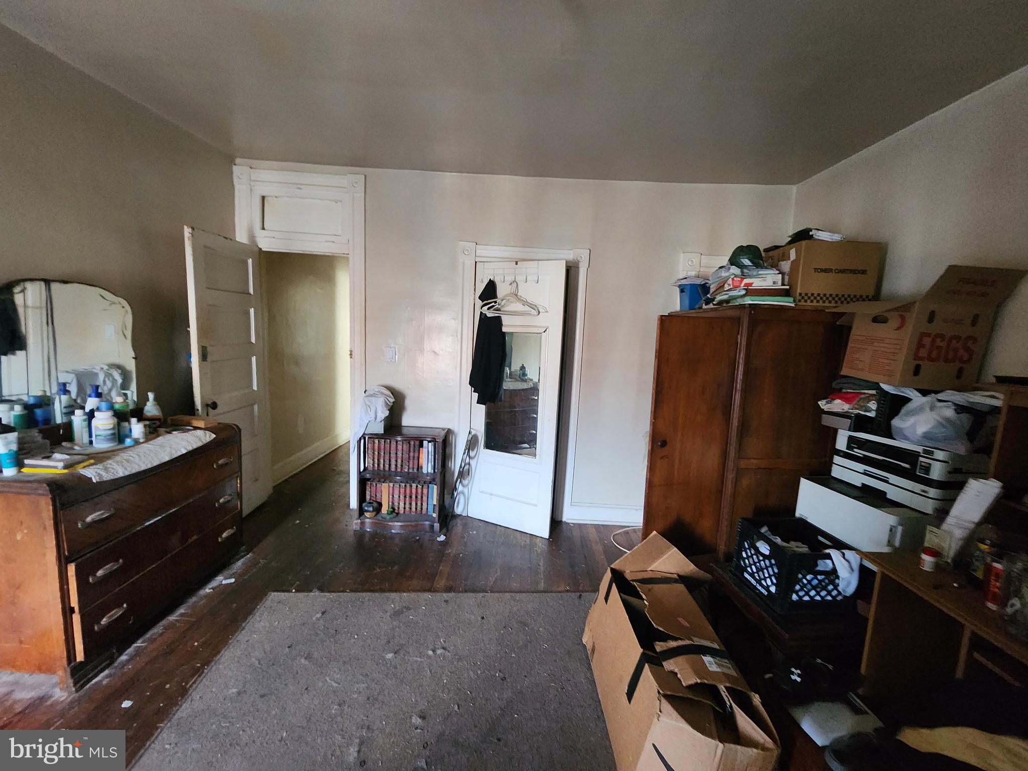 2019 Cecil Avenue Baltimore, MD 21218 - Photo 11 of 17 a room with furniture closet and a flat screen tv