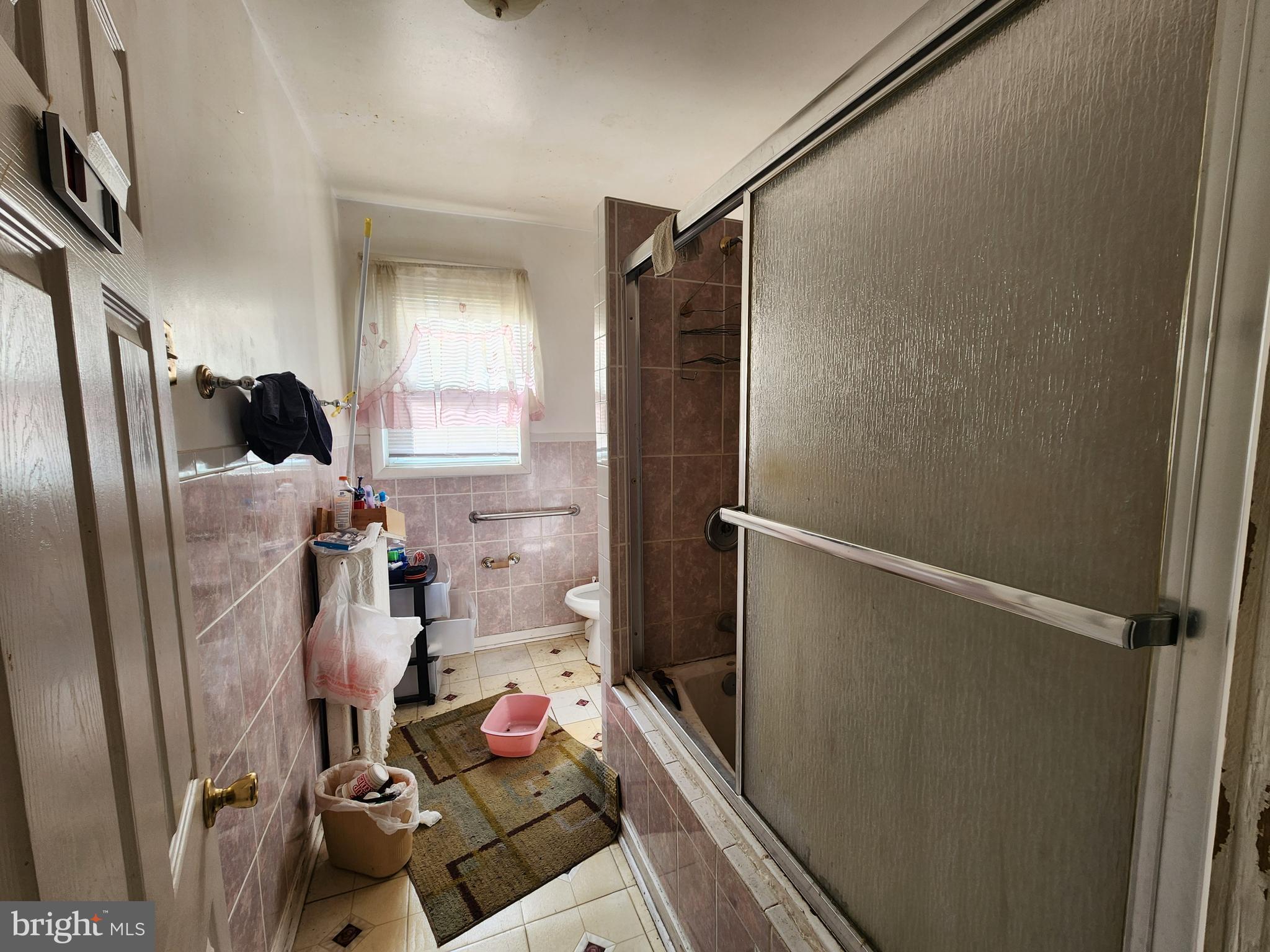 2019 Cecil Avenue Baltimore, MD 21218 - Photo 14 of 17 a bathroom with a sink toilet and shower