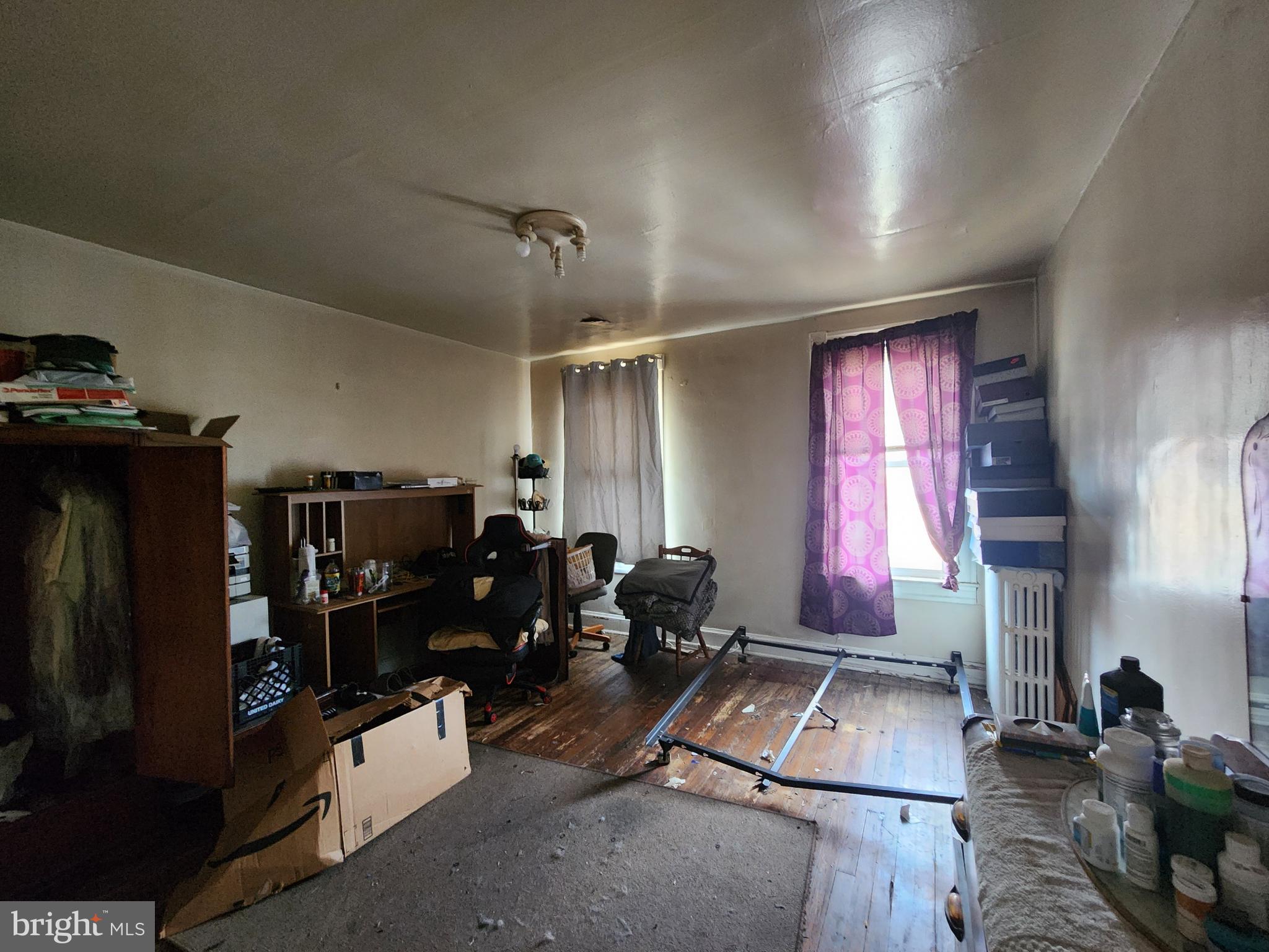 2019 Cecil Avenue Baltimore, MD 21218 - Photo 10 of 17 a living room with furniture gym equipment and a window