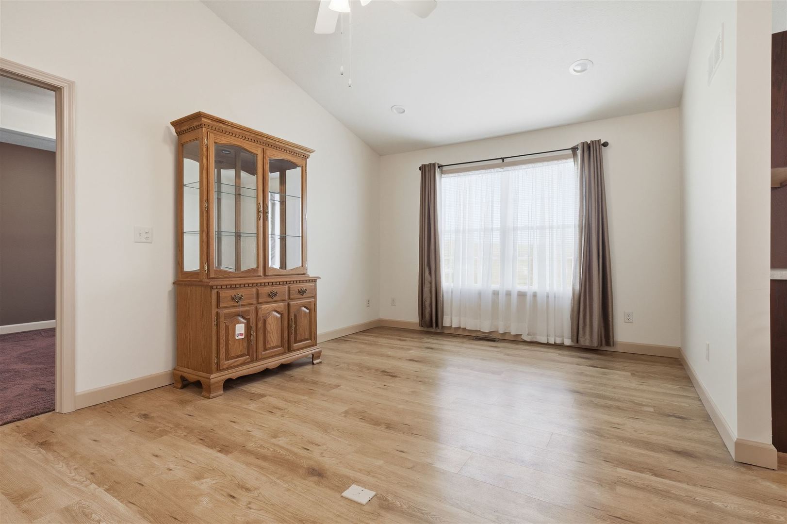 171 Eugene Drive Normal, IL 61761 - Photo 15 of 29 an empty room with wooden floor and windows