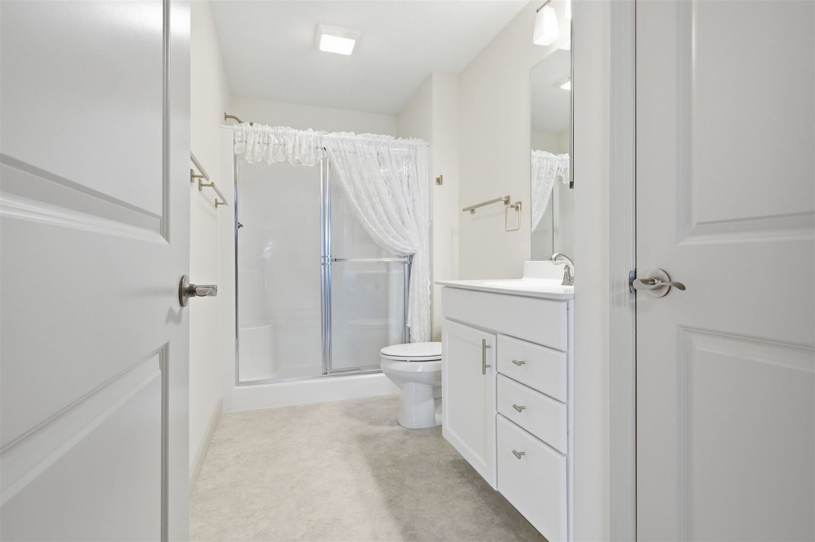 171 Eugene Drive Normal, IL 61761 - Photo 18 of 29 a bathroom with a granite countertop sink a toilet and shower