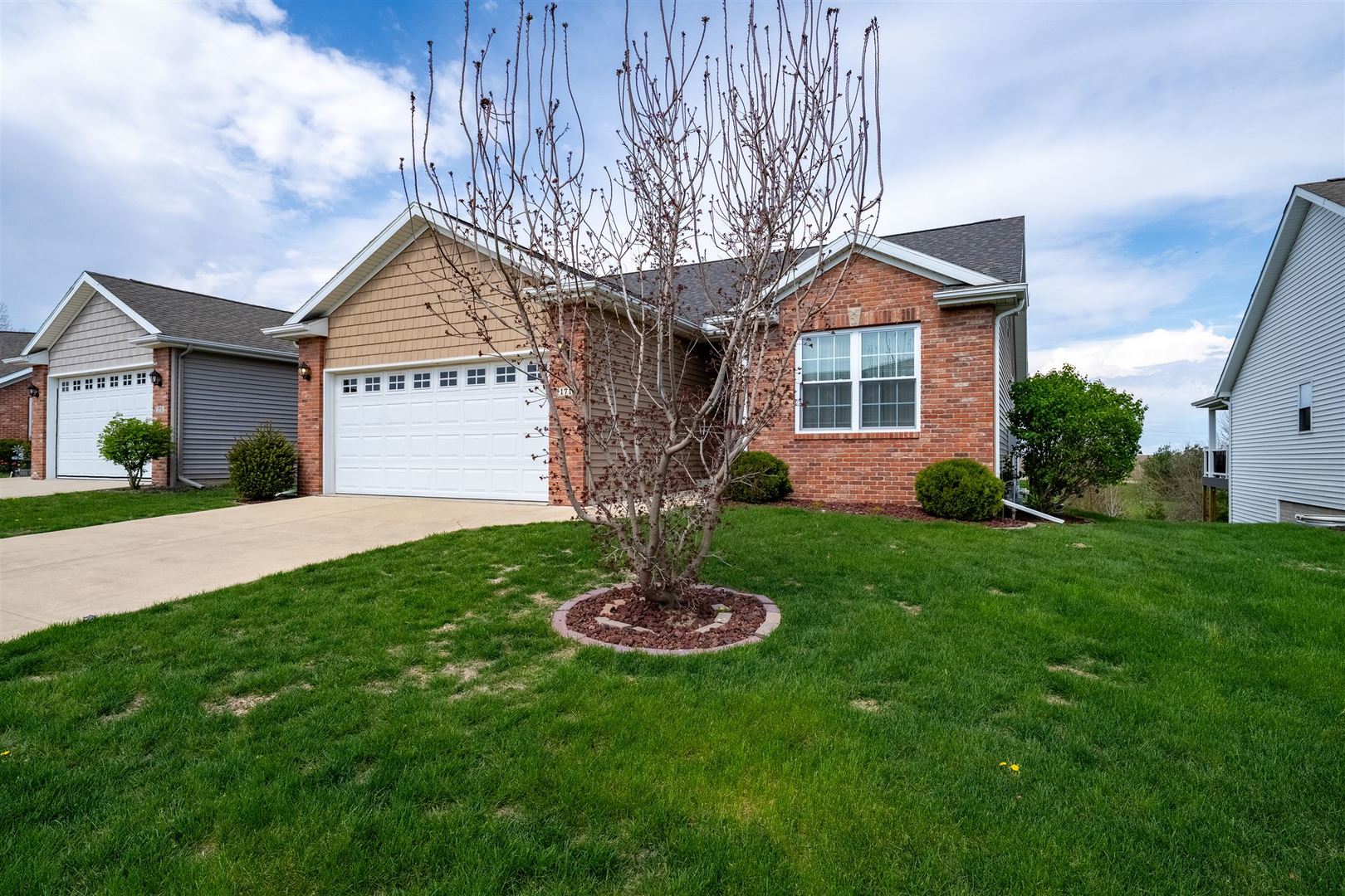 171 Eugene Drive Normal, IL 61761 - Photo 2 of 29 a front view of a house with a yard