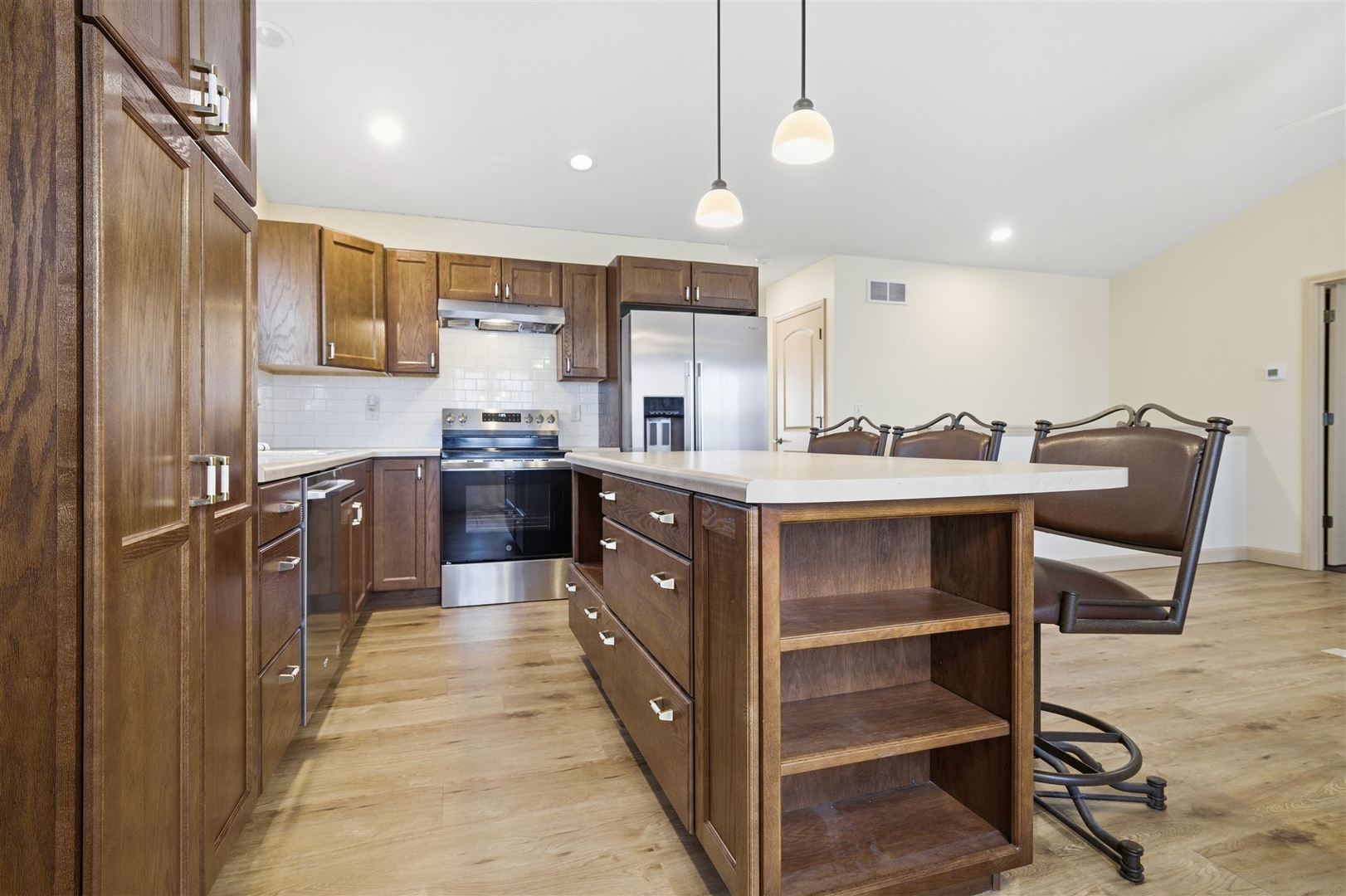 171 Eugene Drive Normal, IL 61761 - Photo 9 of 29 a large kitchen with a large counter top a sink stainless steel appliances and cabinets
