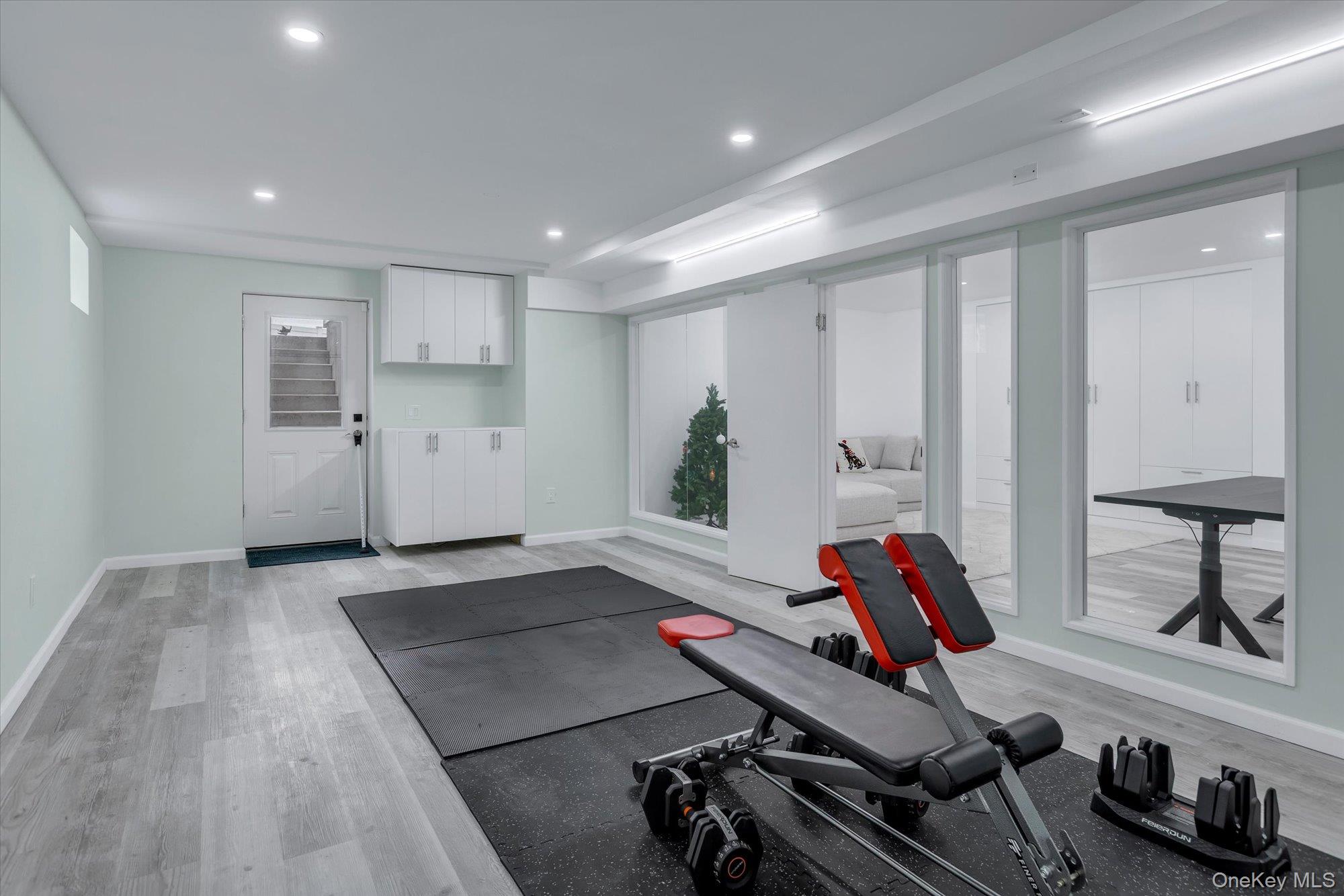 135 Elizabeth Way Ridge, NY 11961 - Photo 19 of 24 a view of a room with gym equipment