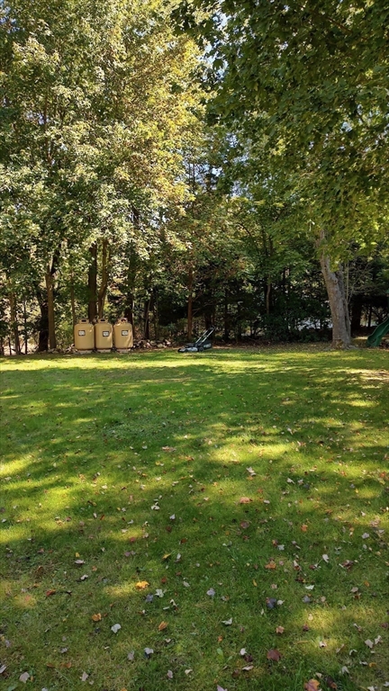 8 Crescent Street Plympton, MA 02367 - Photo 16 of 16 a view of a field with trees in the background