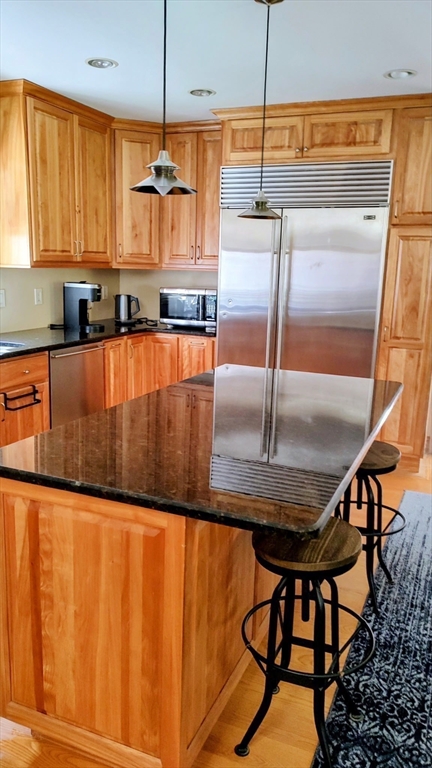 8 Crescent Street Plympton, MA 02367 - Photo 4 of 16 a kitchen with stainless steel appliances granite countertop a stove top oven a sink and dishwasher