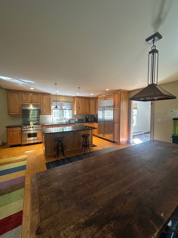 8 Crescent Street Plympton, MA 02367 - Photo 6 of 16 a kitchen with stainless steel appliances kitchen island granite countertop a sink and cabinets