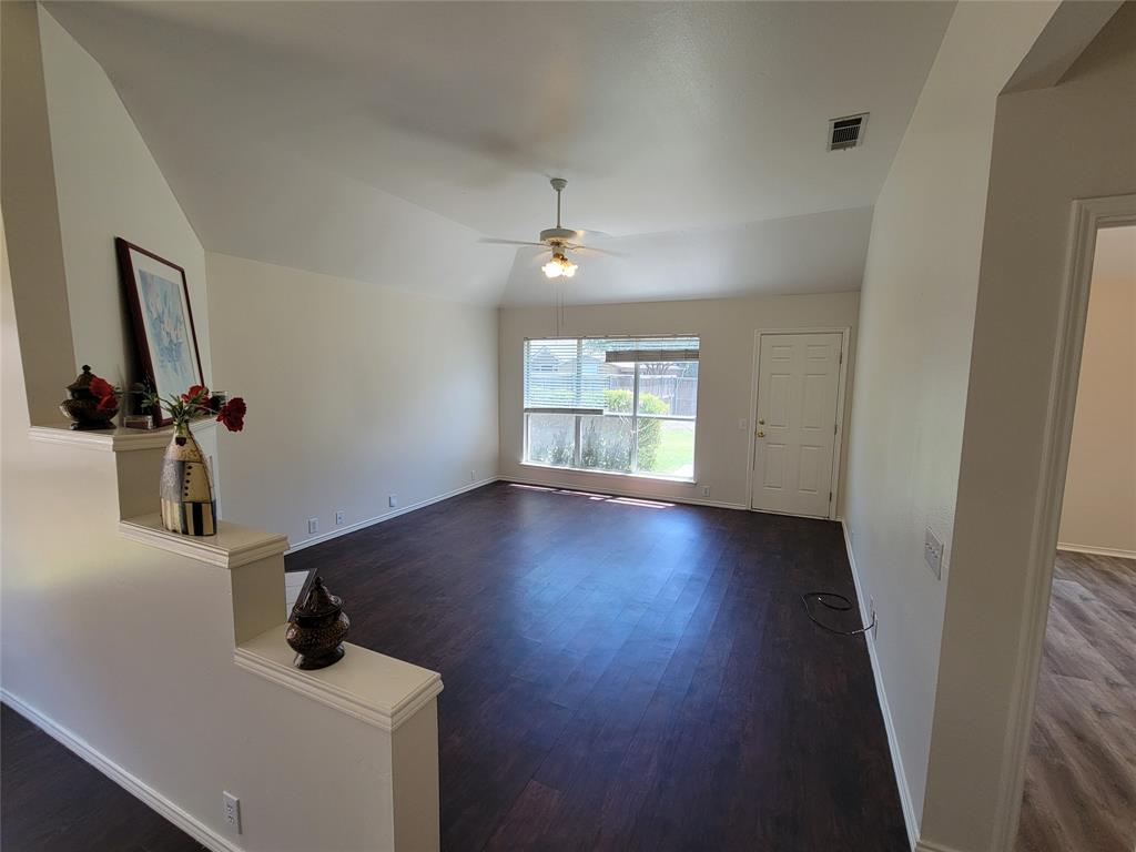 2913 Rush Creek Road McKinney, TX 75072 - Photo 25 of 32 Living room with a fireplace, dark wood-style floors, ceiling fan, and lofted ceiling