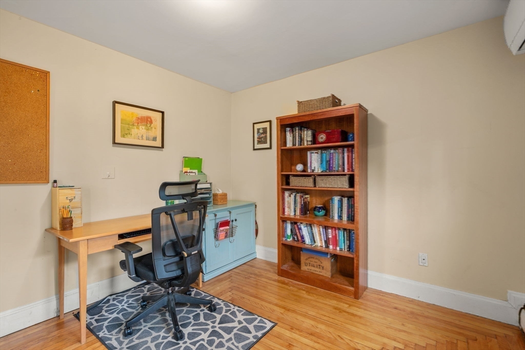 194 College Farm Road Waltham, MA 02451 - Photo 13 of 28 a view of a workspace with furniture and wooden floor