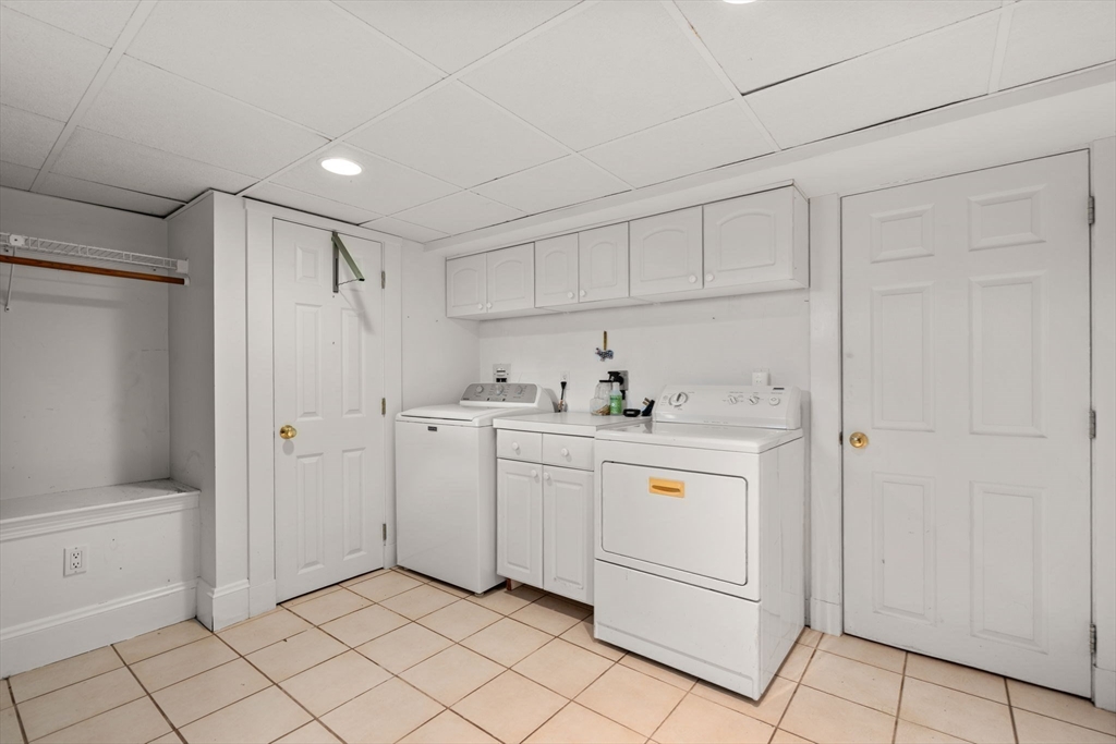 194 College Farm Road Waltham, MA 02451 - Photo 22 of 28 a kitchen with white cabinets and white appliances