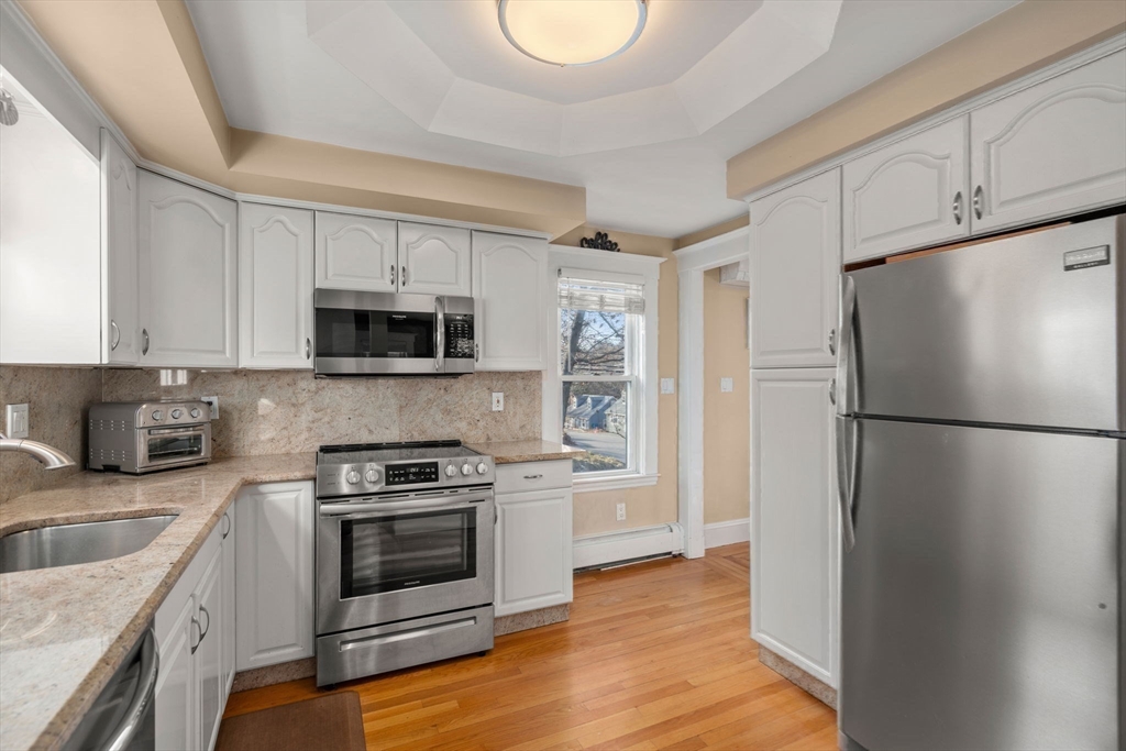 194 College Farm Road Waltham, MA 02451 - Photo 7 of 28 a kitchen with a refrigerator sink and microwave