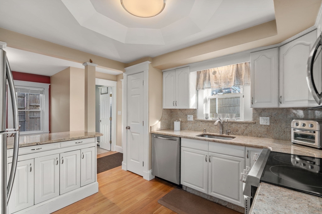 194 College Farm Road Waltham, MA 02451 - Photo 8 of 28 a kitchen with sink cabinets and window