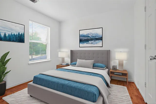 a bedroom with bed and window