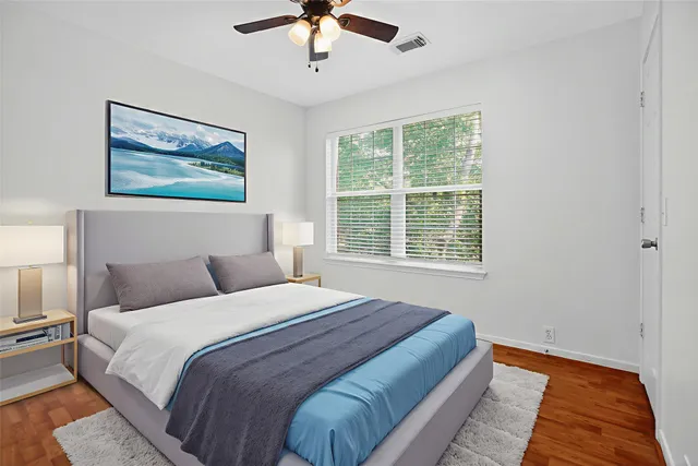 a bedroom with bed and a window