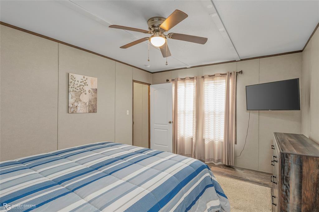 1048 Merritt Mountain Road Many, LA 71449 - Photo 12 of 27 a bedroom with a bed and a flat screen tv