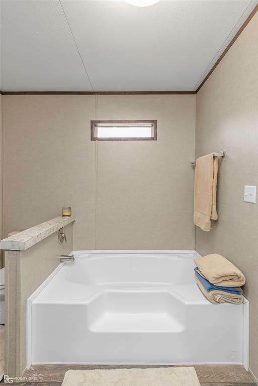 1048 Merritt Mountain Road Many, LA 71449 - Photo 15 of 27 a bathroom with a bathtub and a sink