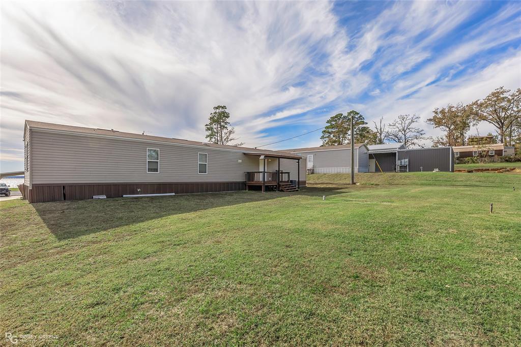 1048 Merritt Mountain Road Many, LA 71449 - Photo 21 of 27 a view of a house with a backyard