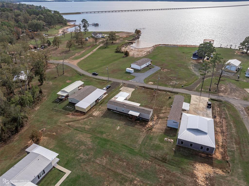 1048 Merritt Mountain Road Many, LA 71449 - Photo 25 of 27 an aerial view of a house with a yard
