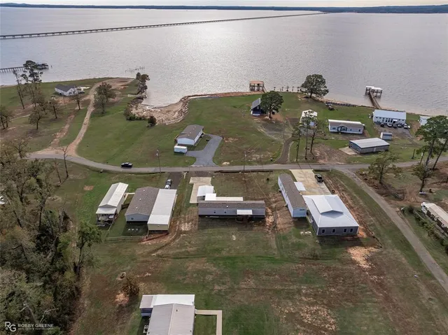 an aerial view of a house with a swimming pool