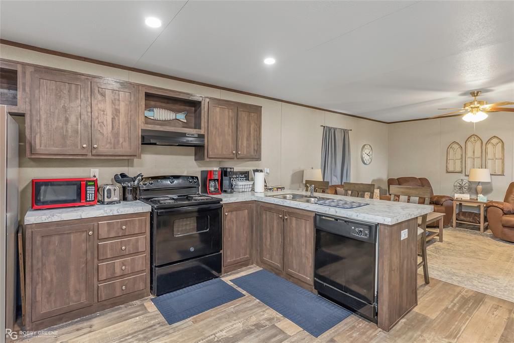 1048 Merritt Mountain Road Many, LA 71449 - Photo 8 of 27 a kitchen with a stove and a sink