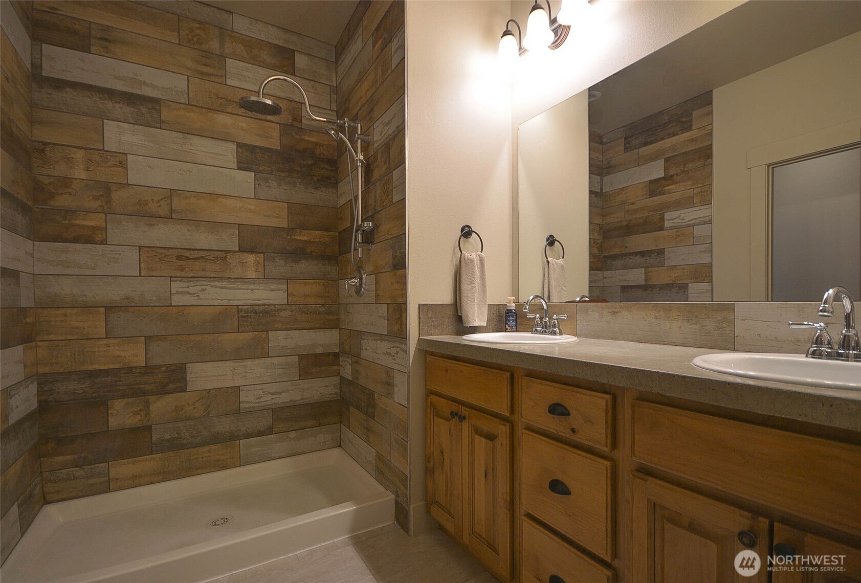 259 Parkside Loop Chehalis, WA 98532 - Photo 26 of 39 a bathroom with a granite countertop sink a toilet and shower