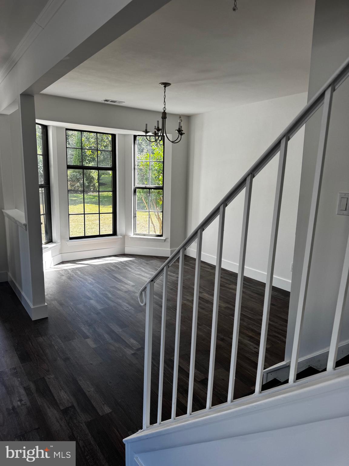 633 Foxton Court Mantua, NJ 08051 - Photo 8 of 14 a view of an empty room with wooden floor and fan