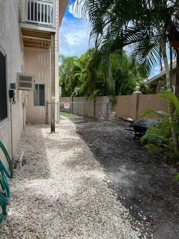 a view of a house with a yard and sitting area