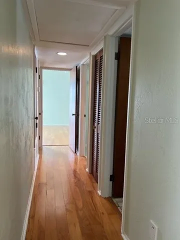 a bathroom with a sink a toilet a mirror and shower